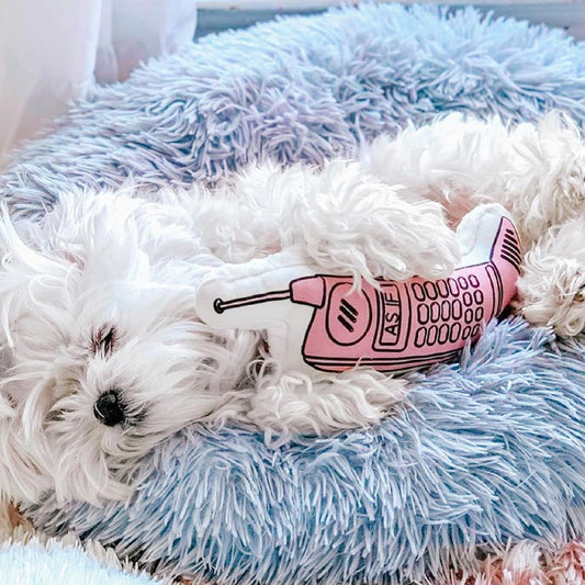 Soft plush donut-shaped pet bed by PAWSOME PETS with cushioned filling for comfort and relaxation.