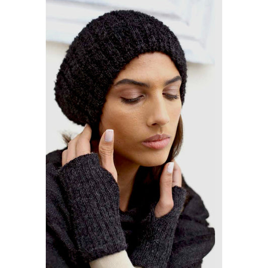 Model in the black alpaca beanie worn slouched back, with black fingerless gloves