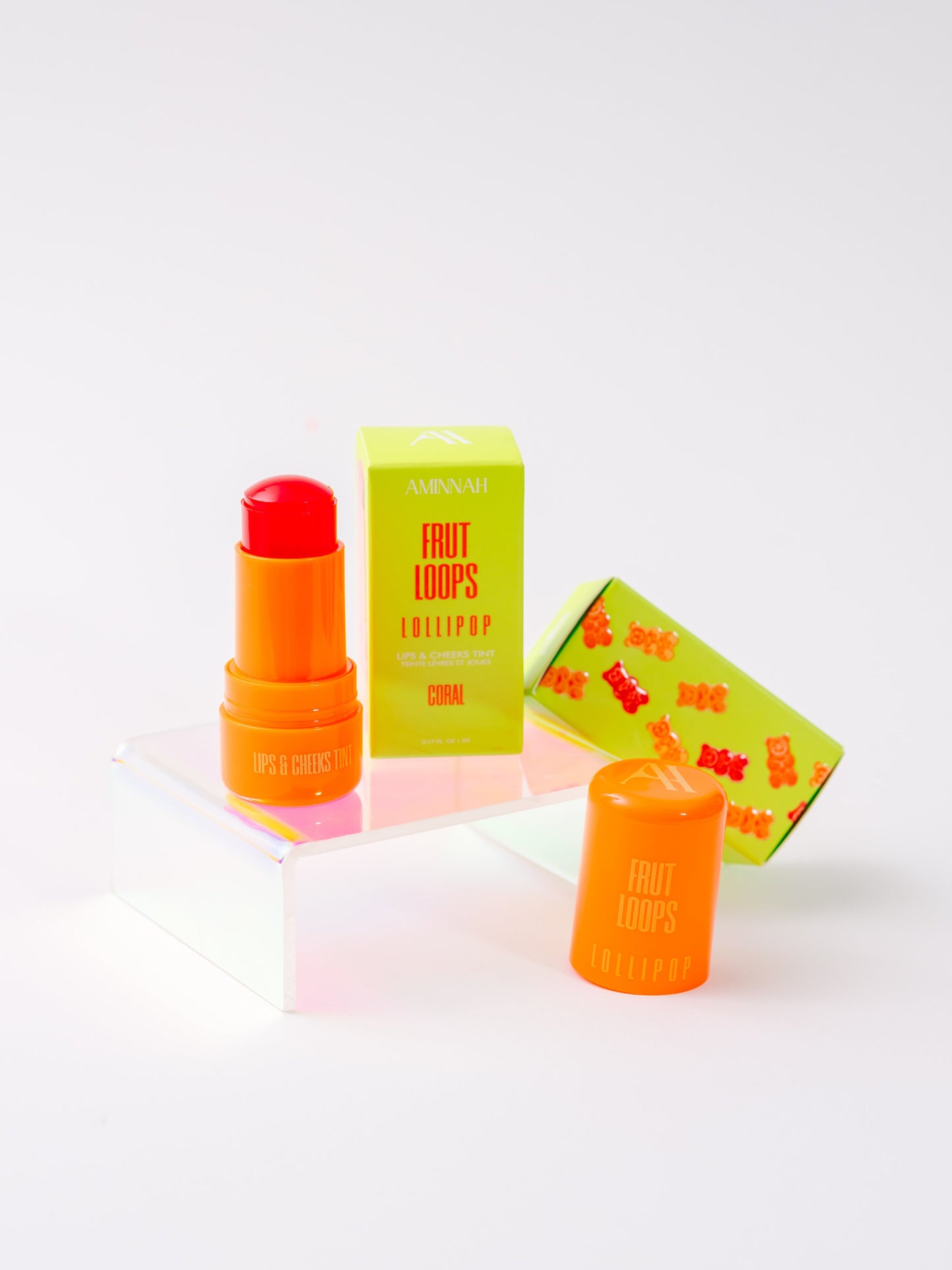 Single tint and its carton lying on a white surface.
