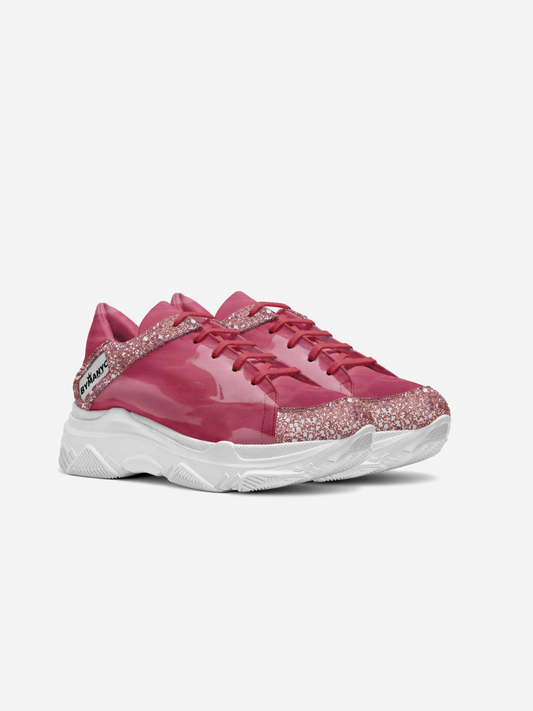 Pink vegan sneakers by BYMANYC New York, angled view showing the platform sole.