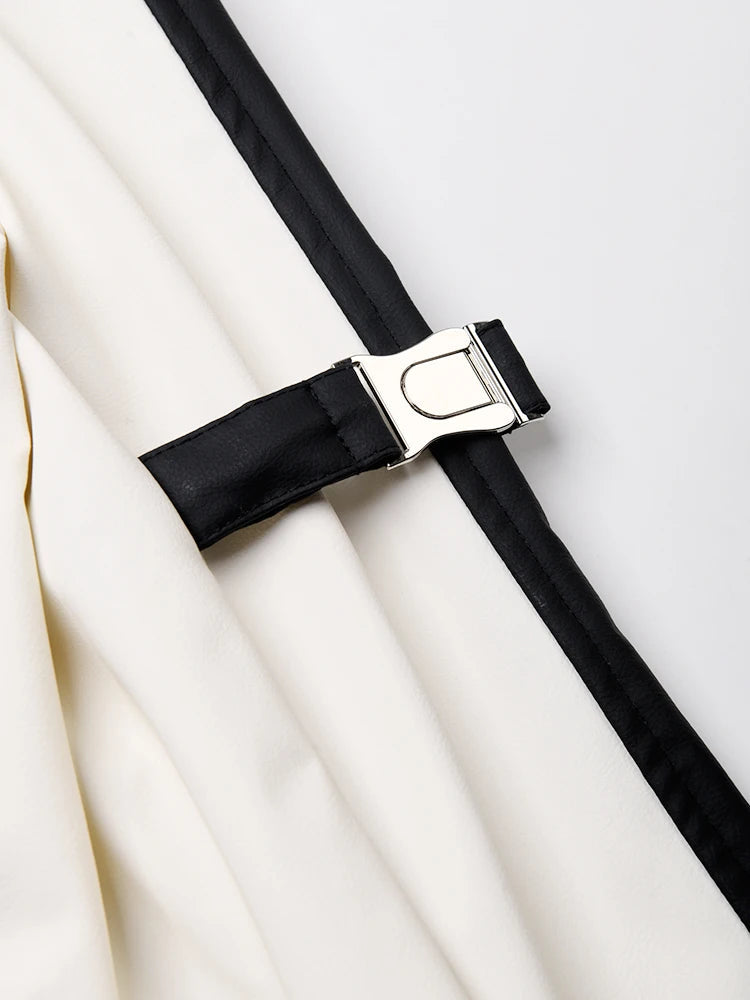 Women's faux leather color-splicing trench coat by BYMANYC New York with contrasting panels.