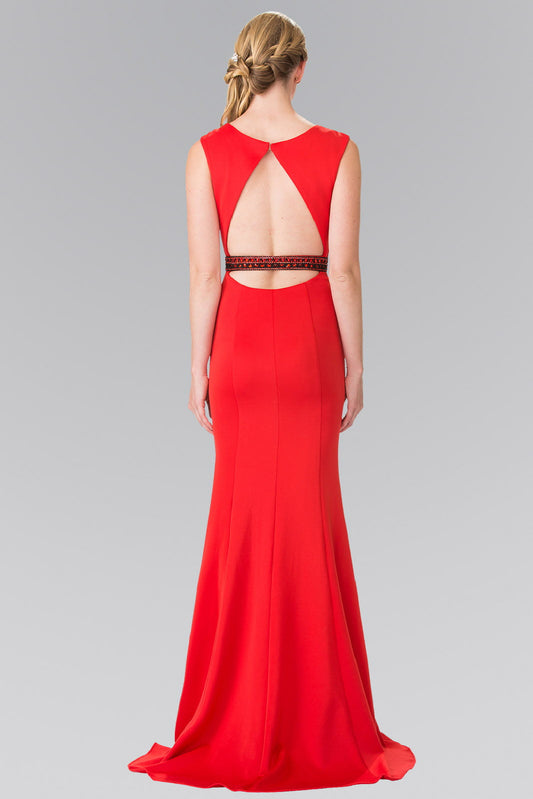 Red jersey mermaid gown, sleeveless, fitted through the hip.