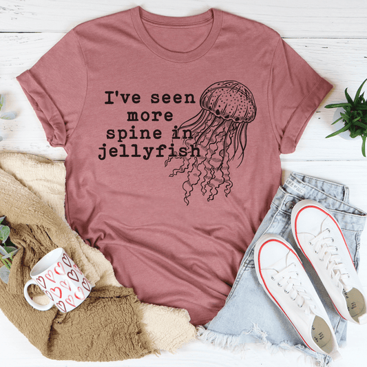 Pink cotton tee featuring a hand-drawn jellyfish above the printed slogan.