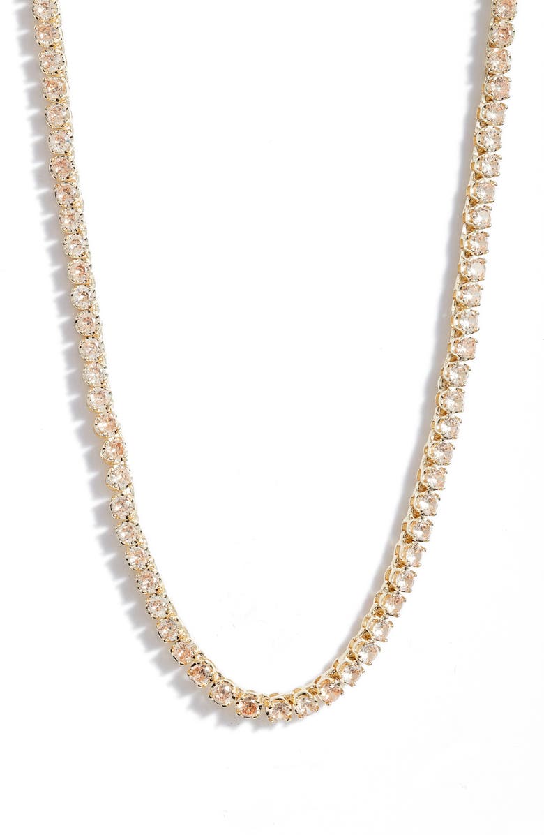 Topaz tennis necklace up close, small round champagne colored stones set side by side in gold tone