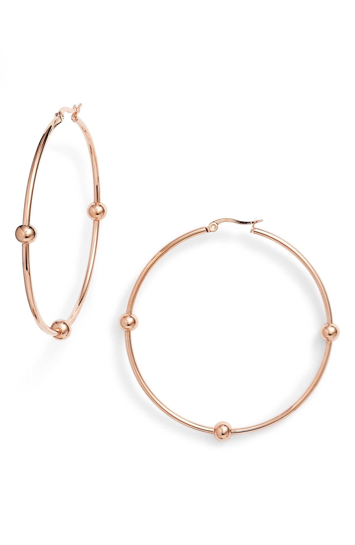 Rose gold tone hoop earrings with small metal beads fixed on each thin hoop and a hinged top closure