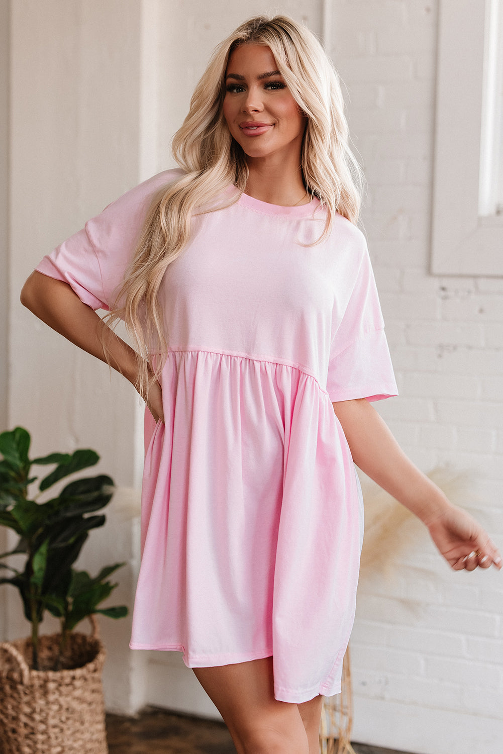 Light pink babydoll dress with raw edge trim, front view