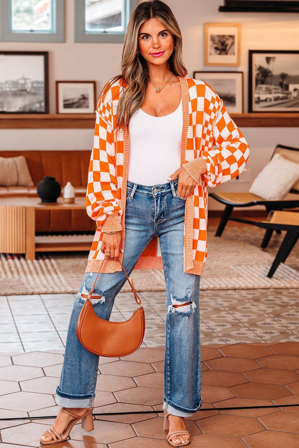 Full length view of the orange checkered cardigan with ripped jeans and a tan bag