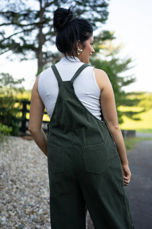 Back view of the dark green corduroy overalls
