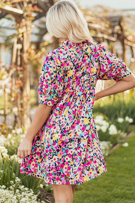 Back view of the pink ditsy floral mini dress