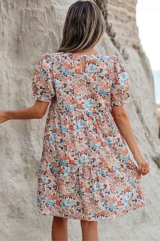 Back view of the apricot floral mini dress with a keyhole