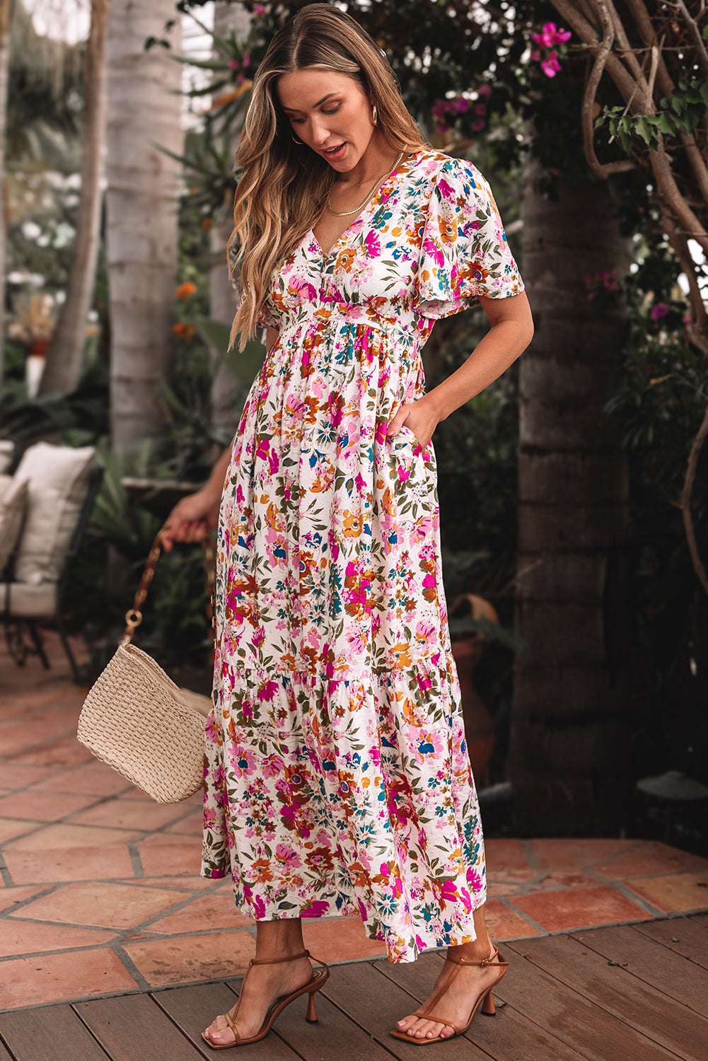 Floral maxi dress with a smocked waist, hand in the pocket