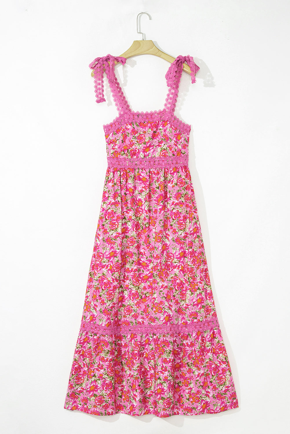Rose pink floral tie strap maxi dress on a hanger