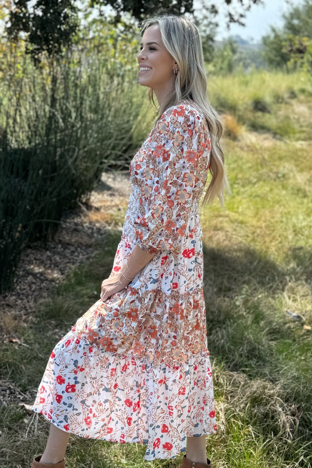 Side view of the pink and cream floral tiered dress
