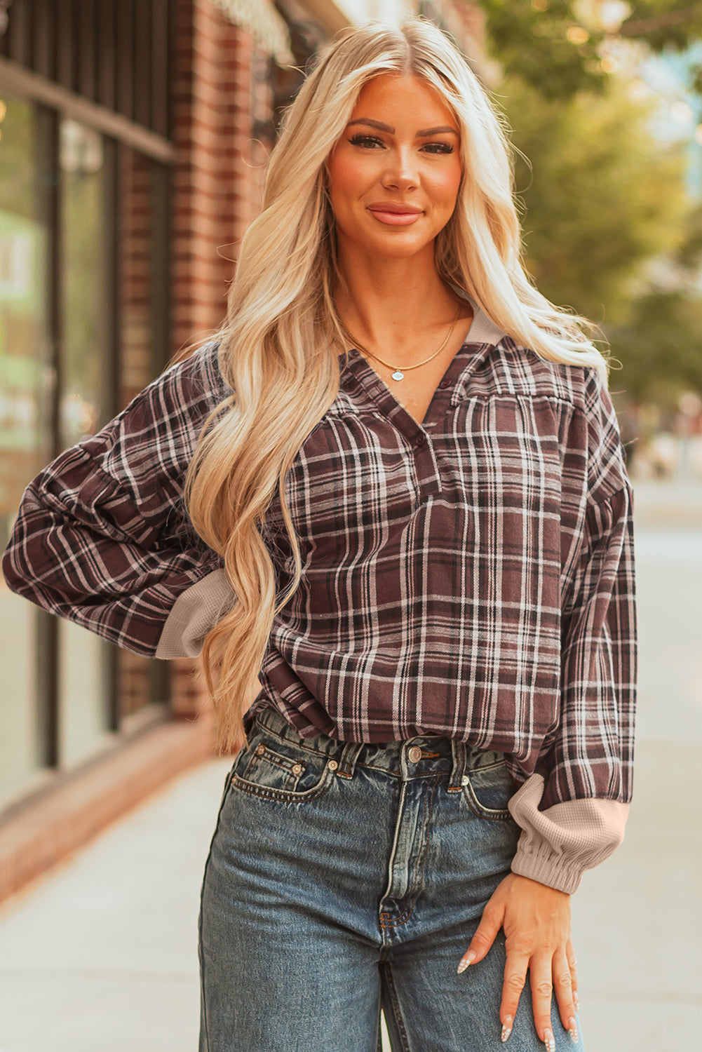 Brown plaid hooded top with beige cuffs, front view