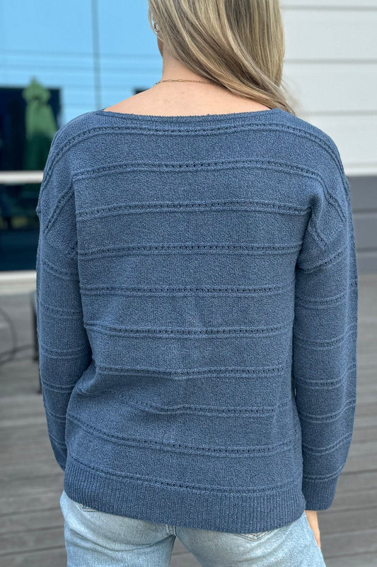 Back view of the denim blue pointelle sweater