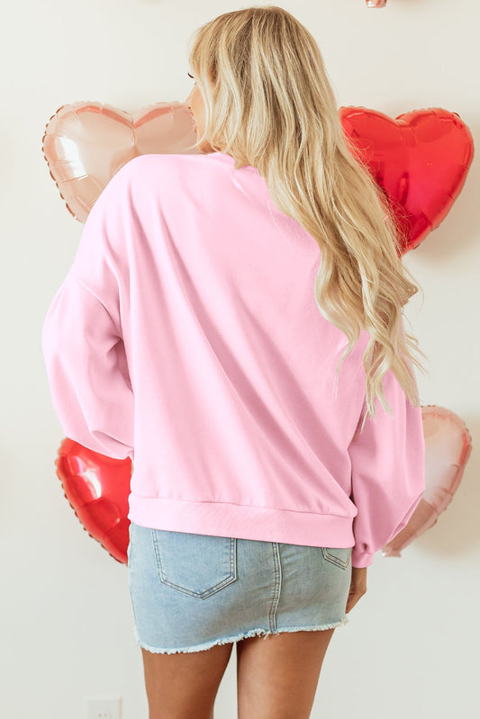 Back view of the light pink lantern sleeve sweatshirt