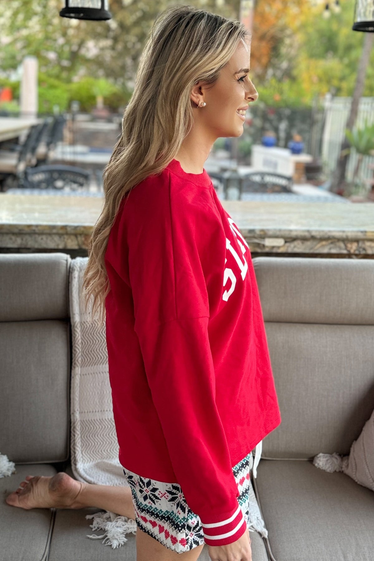 Side view of the red SLEIGH lounge top and shorts