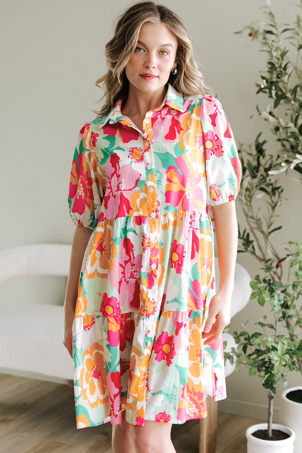 Pink floral colorway of the collared babydoll dress on a model