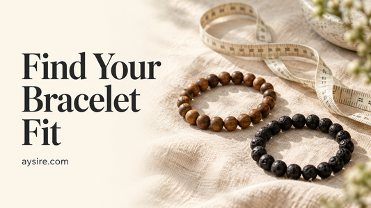 Find Your Bracelet Fit, wood and lava bead bracelets beside a measuring tape on cream linen