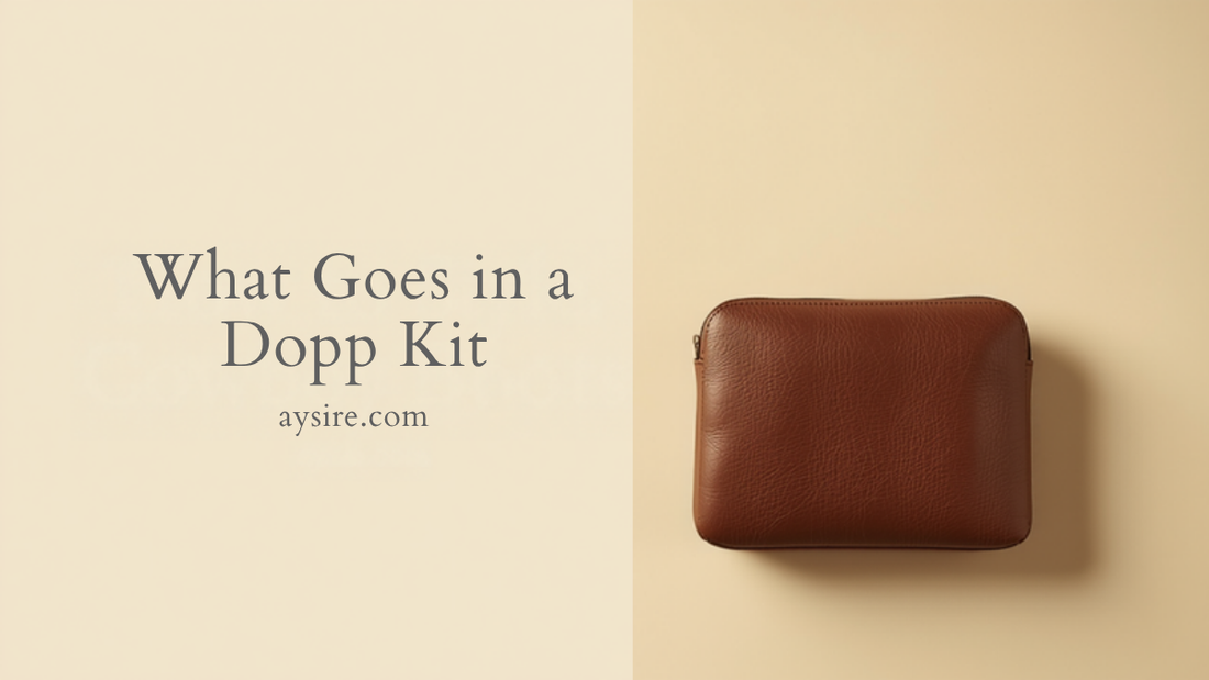 What Goes in a Dopp Kit. Overhead flat-lay of a closed brown pebbled leather dopp kit on cream