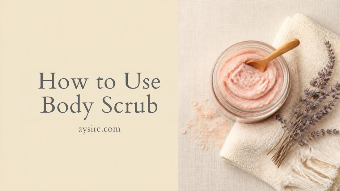 How to Use Body Scrub. A jar of pink whipped sugar scrub with a wooden spoon, a towel and dried lavender on cream.