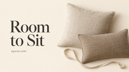 Room to Sit, square and lumbar pillows beside a measuring tape on a cream background