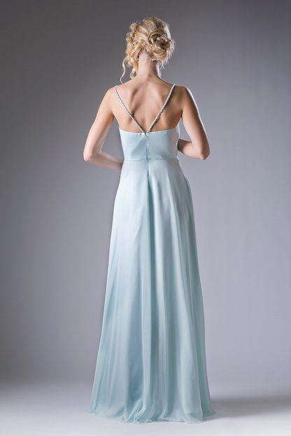Back of a V-neck evening gown, showing the crisscross straps across an open back.