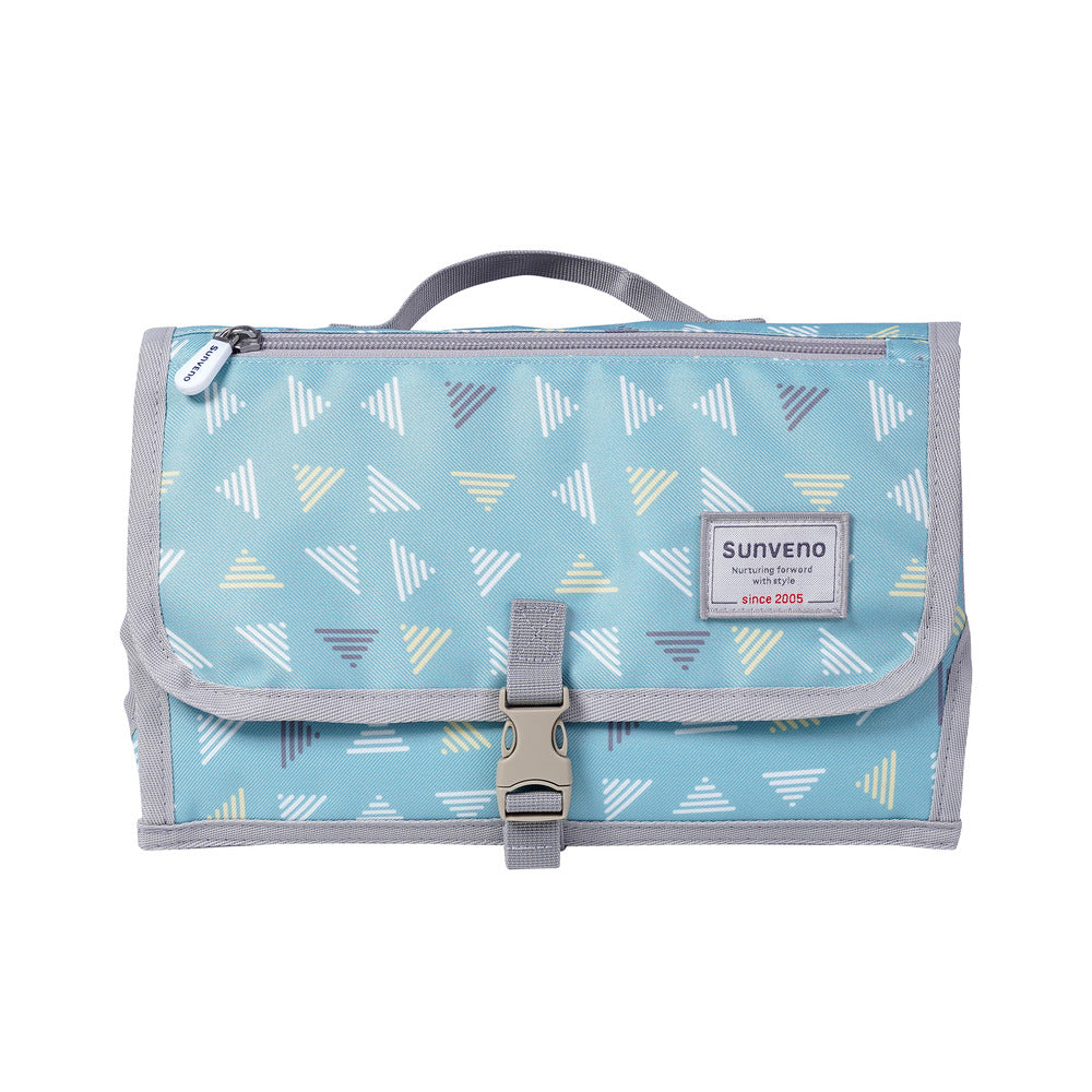 Foldable SUNVENO baby changing pad with head cushion, soft padded surface and foldable design for easy diaper changes.