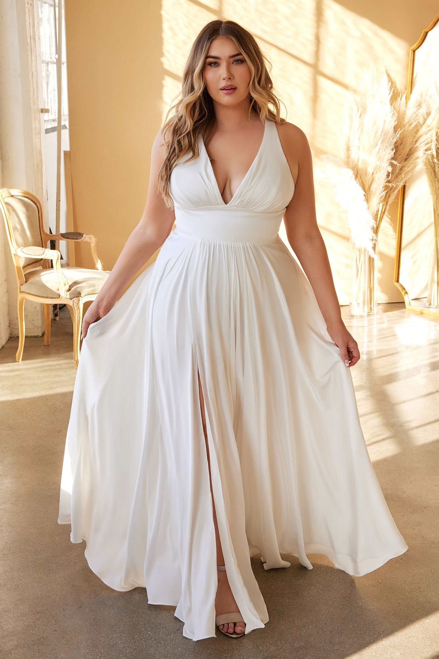 Plus size satin wedding gown with a floor-length design and leg slit, featuring elegant details from Tux-USA.