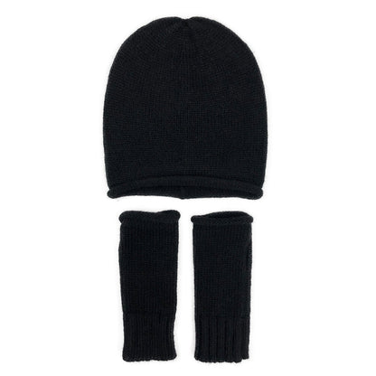 Black slouchy beanie above a pair of matching black fingerless gloves, laid flat on white