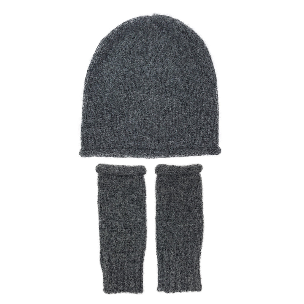 Charcoal beanie laid flat above a pair of matching charcoal fingerless gloves on white