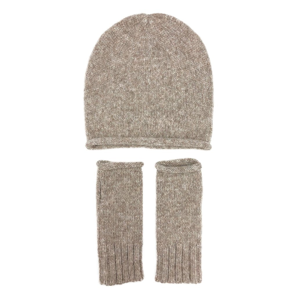 Beige slouchy beanie above a pair of matching beige fingerless gloves, laid flat on white