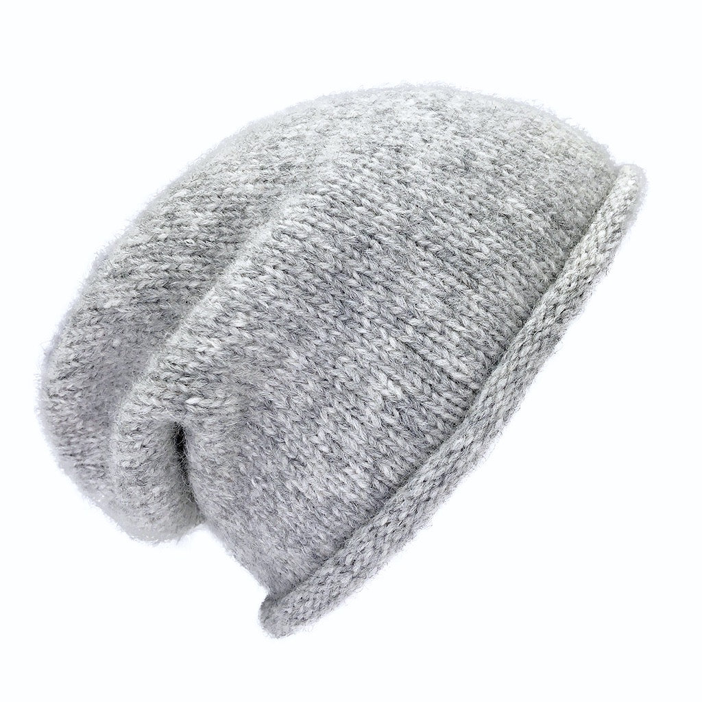 Heather gray slouchy beanie with a rolled brim, shown from the side on white