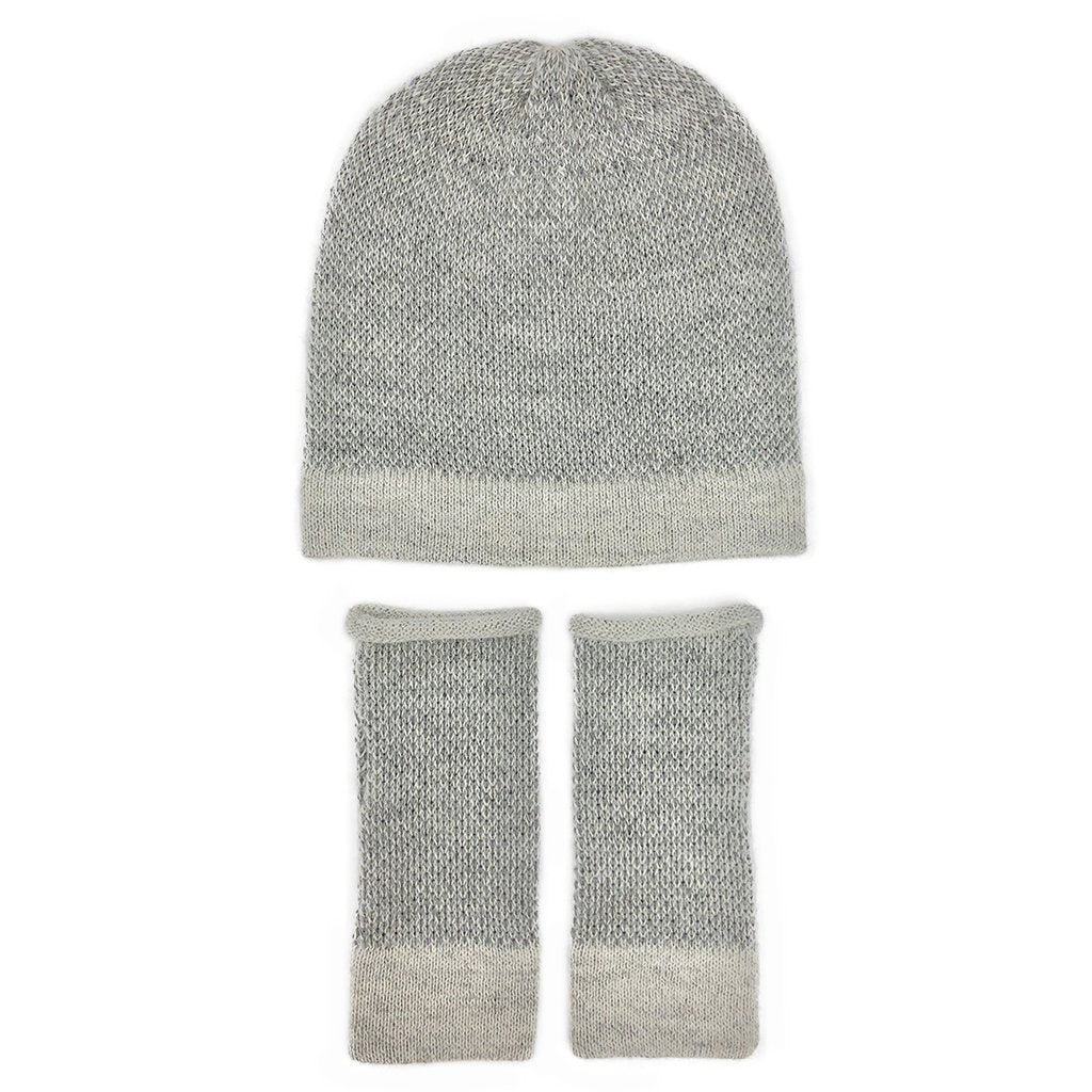 Gray alpaca hat laid flat above a pair of matching fingerless gloves