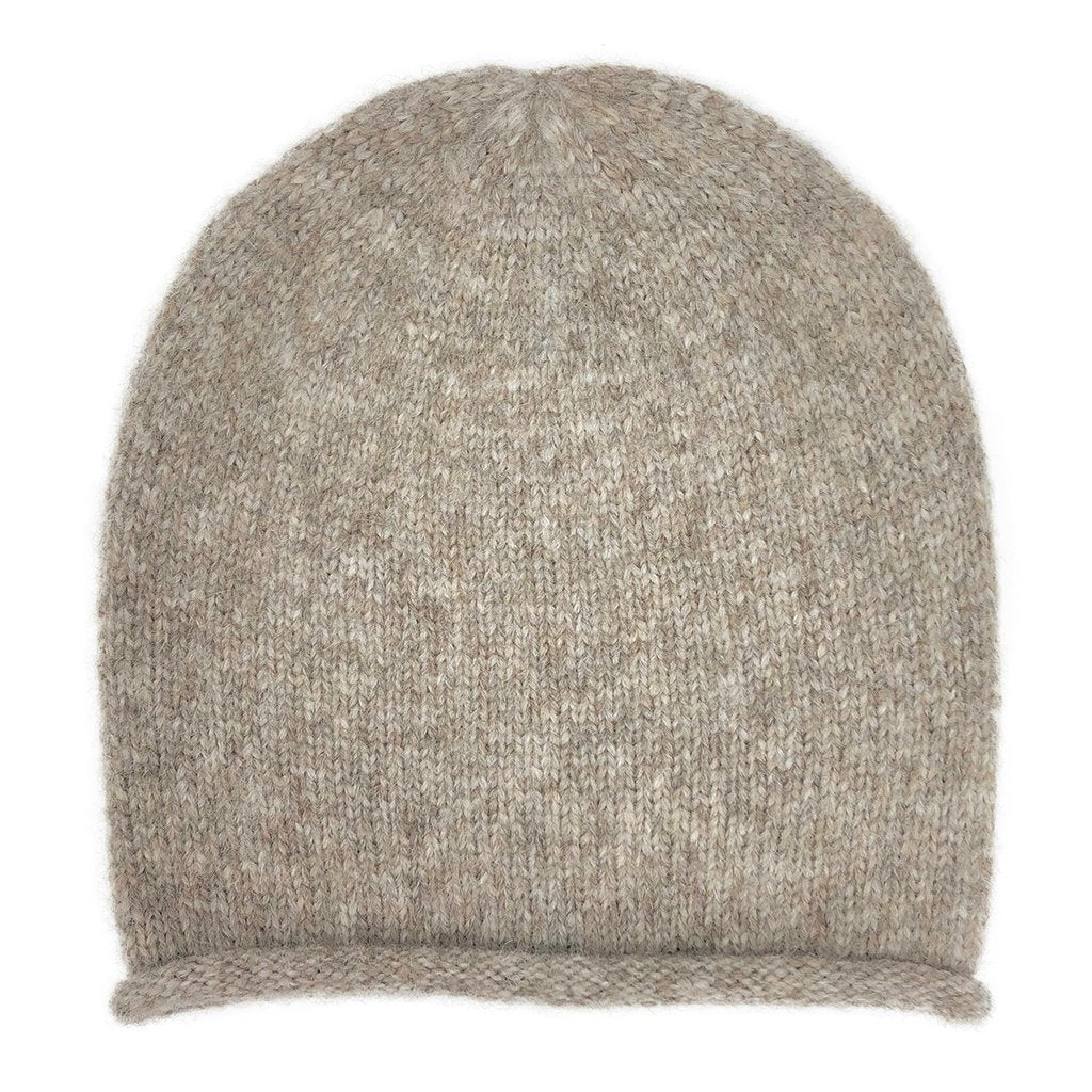 Beige baby alpaca blend beanie laid flat from the front, showing its soft heathered knit