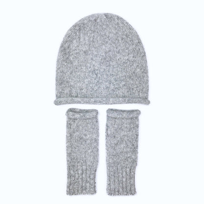 Heather gray slouchy beanie above a pair of matching gray wrist warmers, laid flat on white