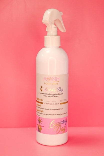Single room spray bottle standing on a deep pink background.