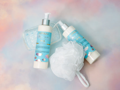 Cleanser bottles beside a white mesh bath puff on pastel.
