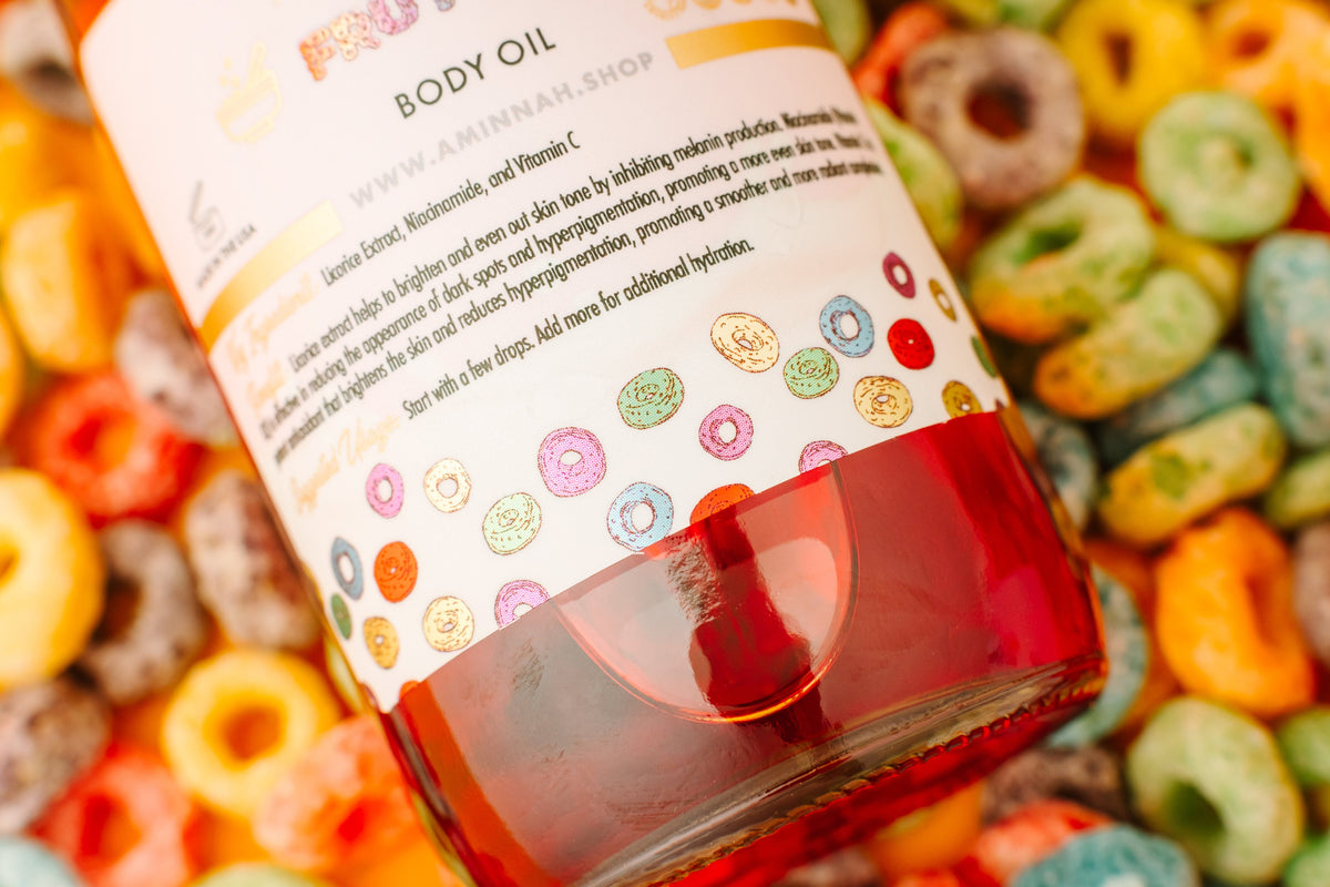 Body oil bottle label seen close up with cereal loops behind it.