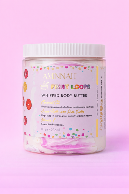 Jar of Frut Loops whipped body butter with the label facing forward on pale pink.