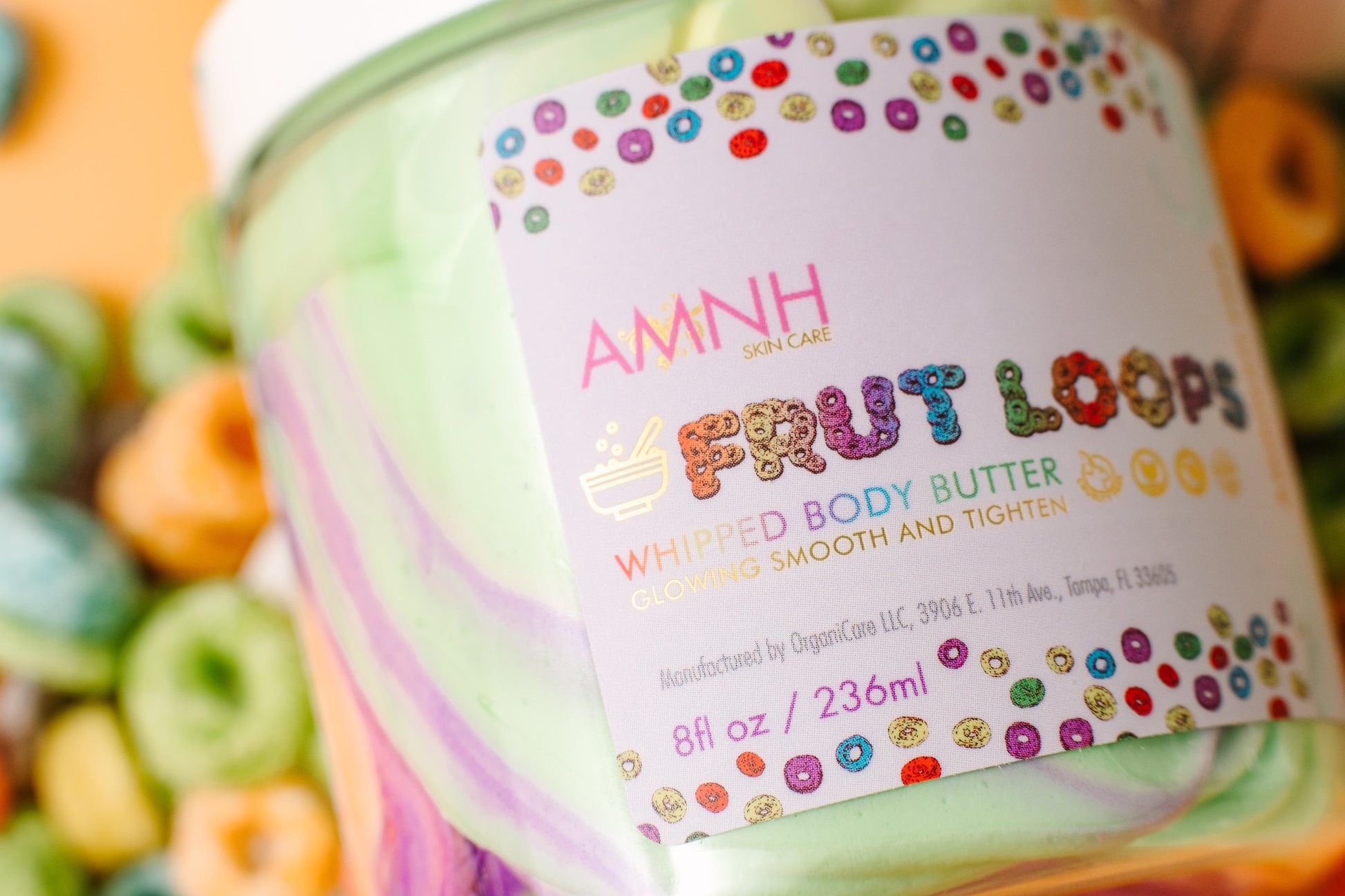 Close view of the AMNH Frut Loops jar label with cereal loops behind it.
