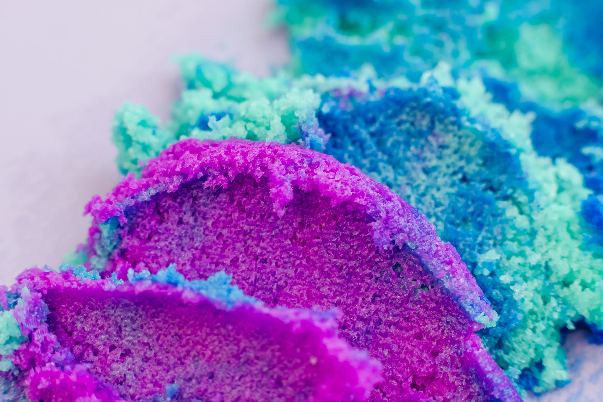 Close view of the blue and purple sugar scrub texture.