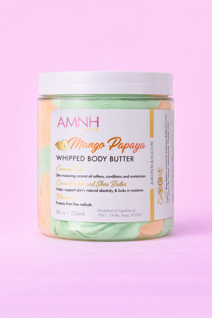 Jar of Mango Papaya body butter with the label facing forward on pale pink.