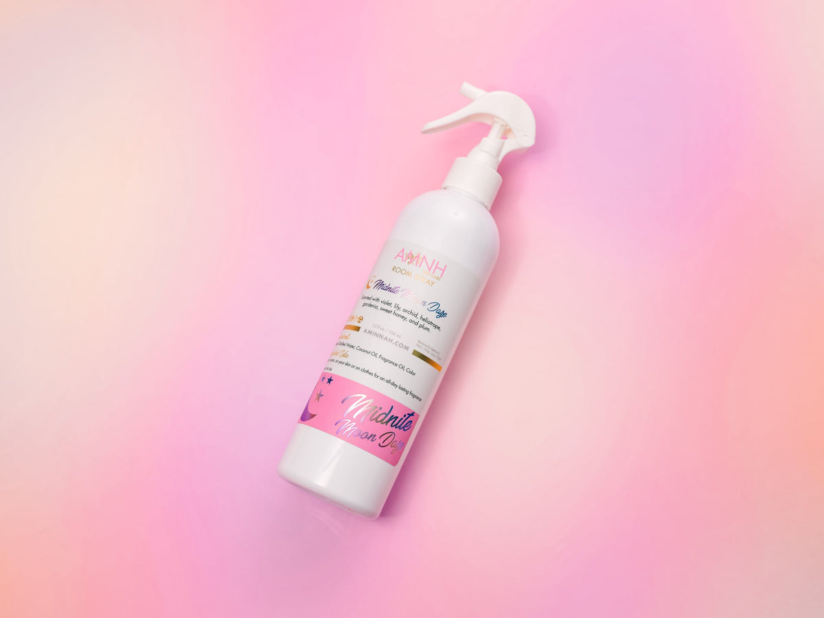 Single room spray bottle standing on a soft pink gradient.