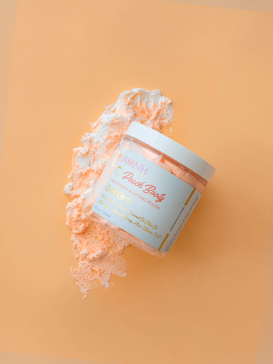 Jar with peach sugar scrub spilling out onto an orange background.