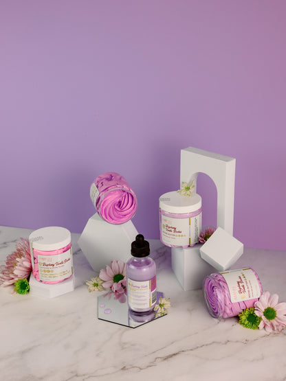 Jars, a dropper bottle and small flowers arranged on lilac.