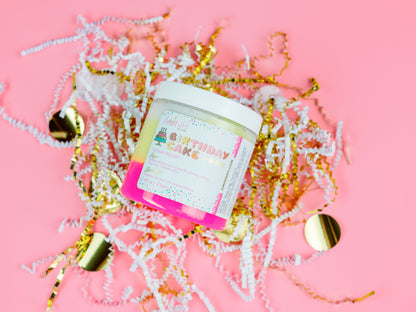 Jar standing in pink paper shred on a pink background.