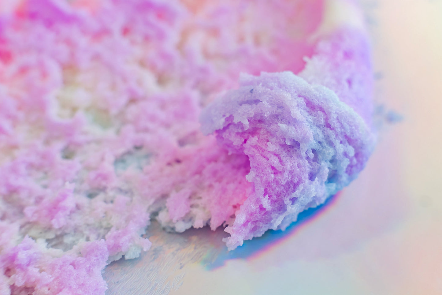 Close view of the pastel sugar scrub texture.