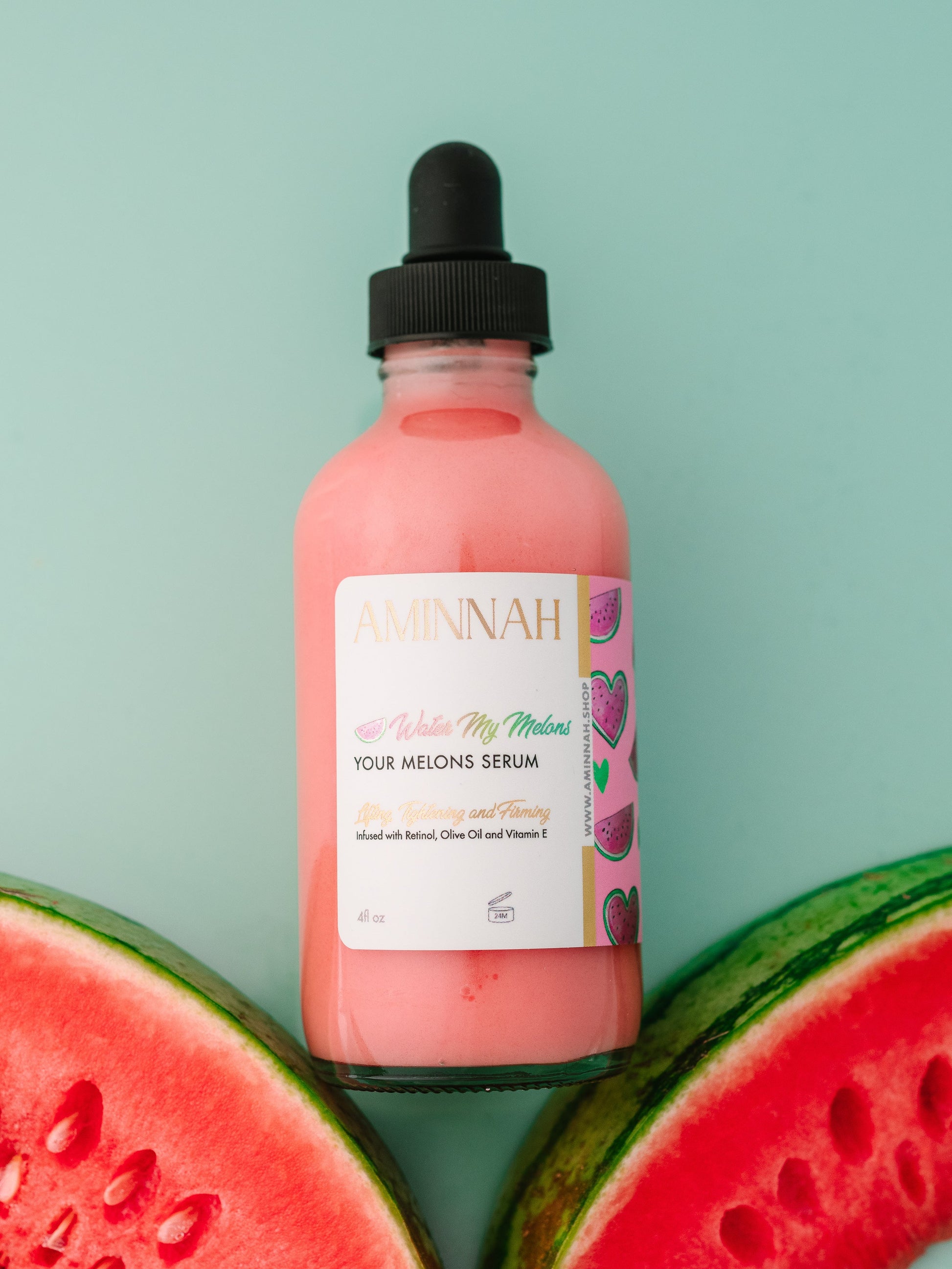 Serum bottle standing on a slice of watermelon.