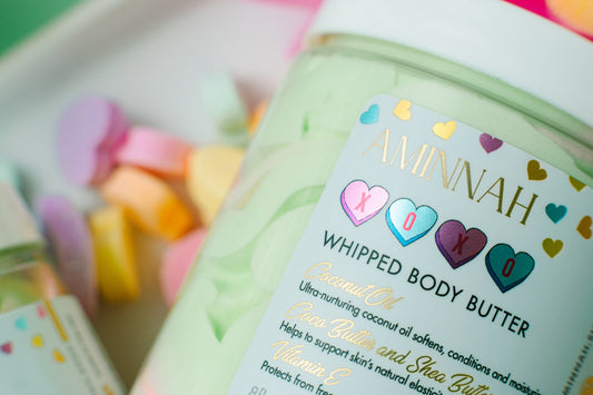 Close view of the AMNH XOXO whipped body butter jar label.